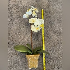 Faux orchid in ceramic vase